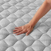 Hand pressing on the Beautyrest Select Mattress to show firmness level ||feel: Firm