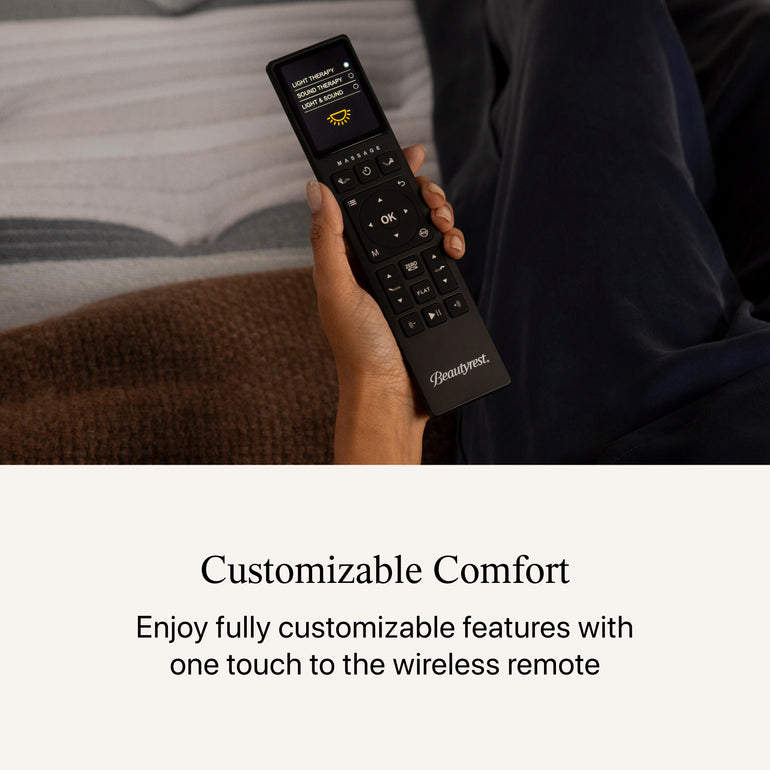 Womans hand holding the Motion Restore Base remote.  below the image, the headline states Customizable Comfort  Enjoy fully customizable features with one touch to the wireless remote