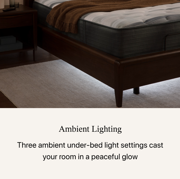 Corner of Beautyrest mattress sitting in a brown bed frame. below the image, the headline states Ambient Lighting  Three ambient under-bed light settings cast your room in a peaceful glow