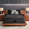 The Beautyrest Black deluxe c-class firm mattress in a bedroom ||series: deluxe c-class|| feel: extra firm