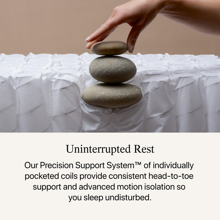 3 rocks stacked on top of the Beautyrest Harmony hybrid Exceptional Driftwood Bay mattress to show firmness level || series: Exceptional Driftwood Bay