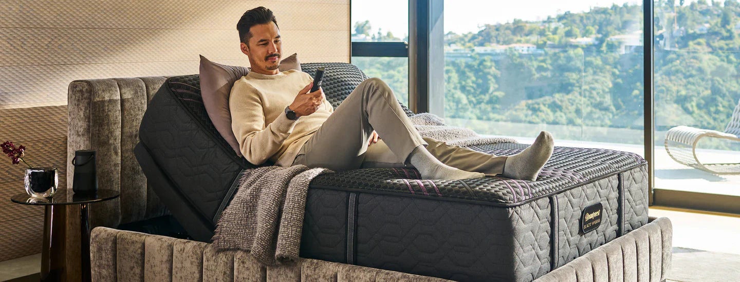Man relaxing on adjustable bed