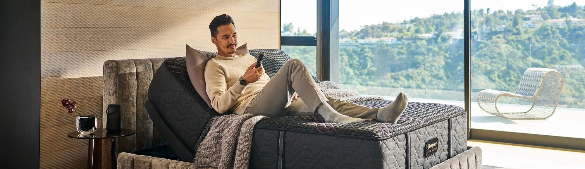 Man on adjustable Beautyrest mattress and bed