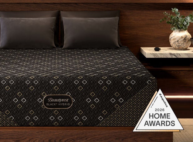 Beautyrest Black Hybrid mattress in a bedroom with an award badge from home awards