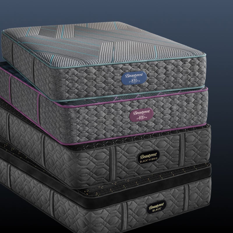 Stacked mattresses with visible labels