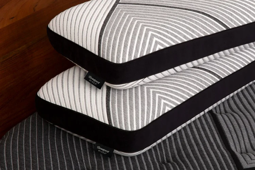 Striped memory foam pillows on bed