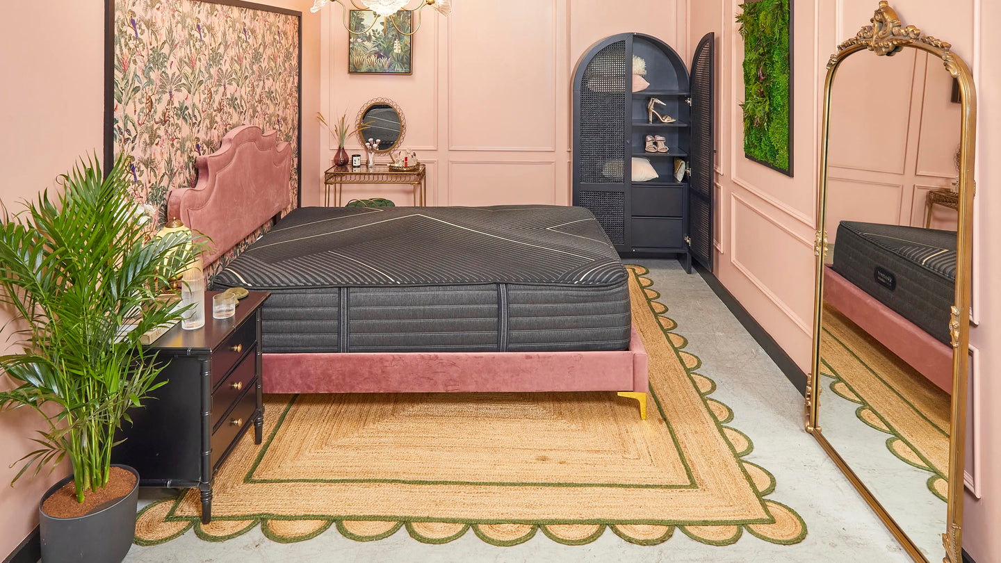 Apartment Therapy room design in the Small/Cool NYC event designed by Natalie Wong using different shades of pink and gold and the Beautyrest Black Hybrid bed