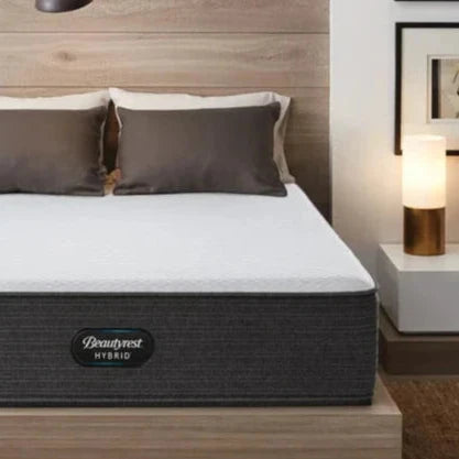 Corner shot of a Beautyrest Select Hybrid mattress in a bedroom