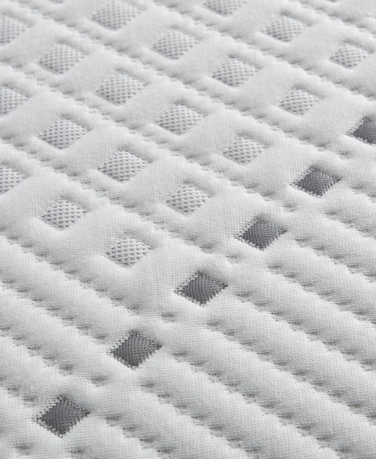 Close-up view of the fabric on a Beautyrest Hybrid BRX1000-IP Plush mattress