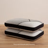 Two Beautyrest Black Luxury Foam Pillows stacked in a bedroom