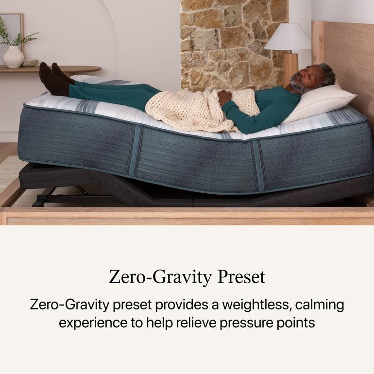 A man sleeping in a bedroom on the Beautyrest Advanced Motion adjustable base