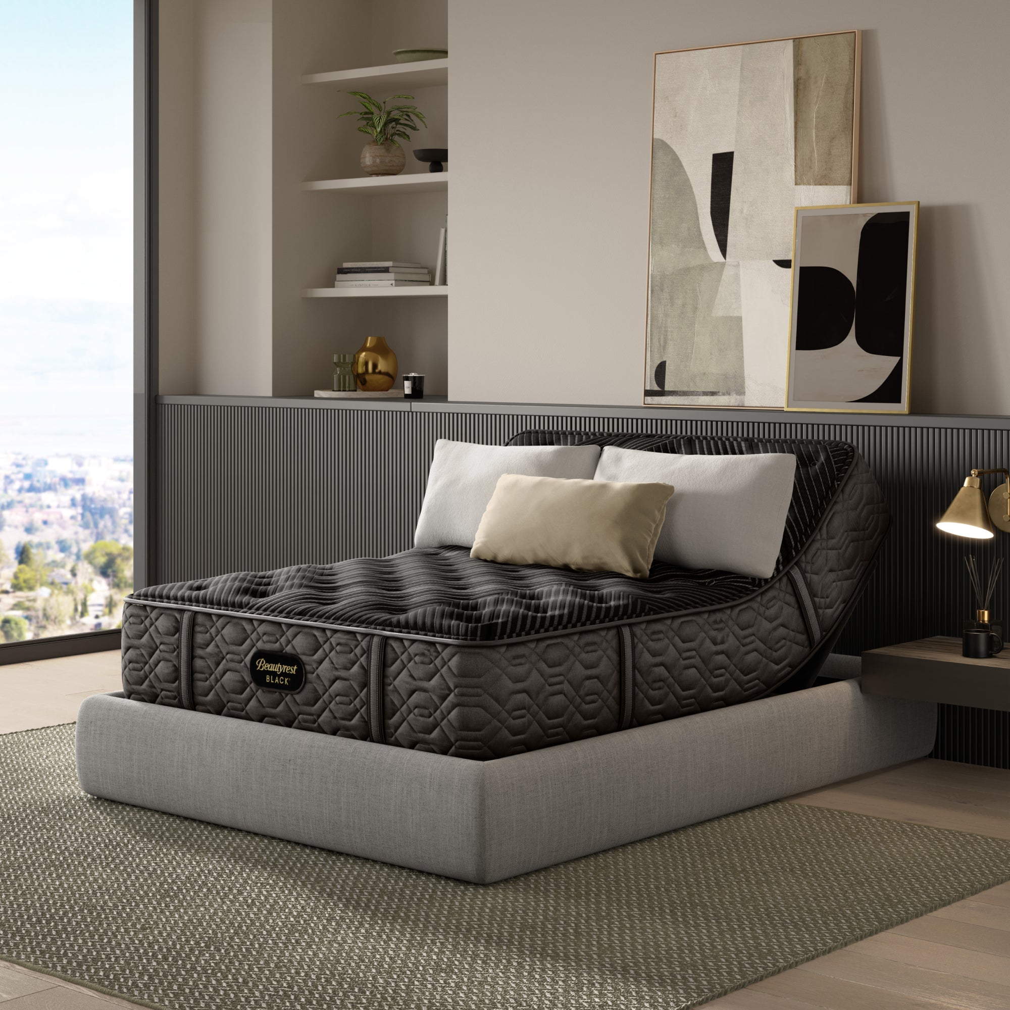 The Beautyrest Black mattress in a bedroom on a light greay bed frame || series: Series One