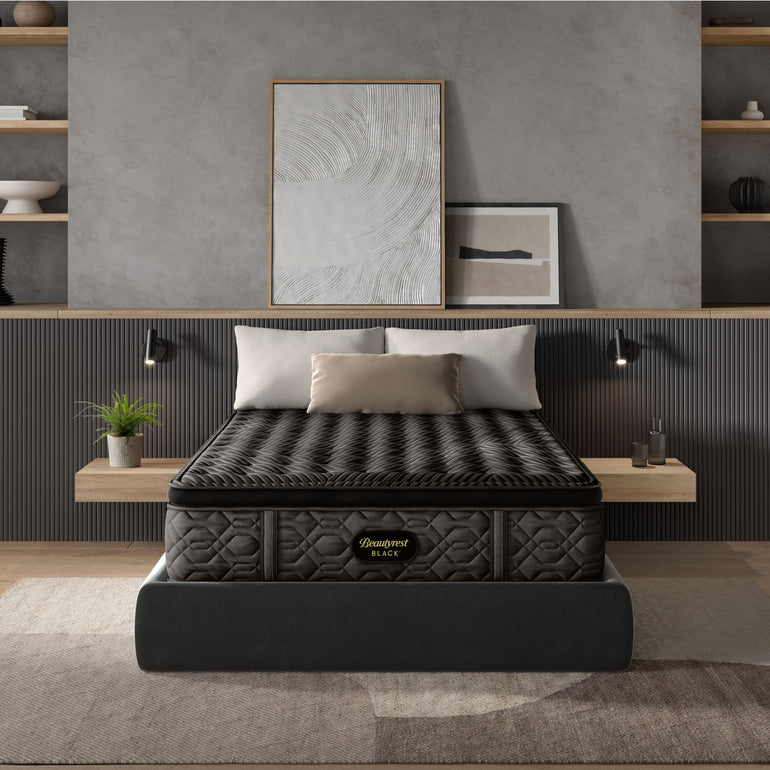 The Beautyrest Black medium pillow top mattress in a bedroom on a black bed frame || series: Series One || feel: medium pillow top