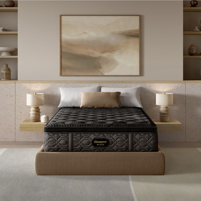 The Beautyrest Black plush pillow top mattress in a bedroom on a light greay bed frame || series: Series One || feel: plush pillow top