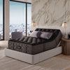 The Beautyrest Black mattress in a bedroom on an adjustable frame sitting in a beige bed frame || series: Series Three