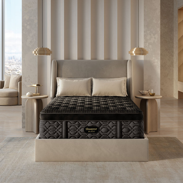 The Beautyrest Black Plush summit pillow top mattress in a bedroom on a beige frame || series: Series Four || feel: Plush Summit Pillow Top