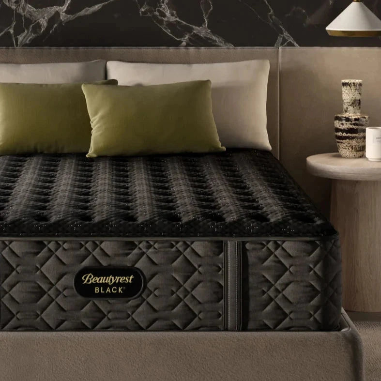 Corner shot of a Beautyrest Black mattress in a bedroom