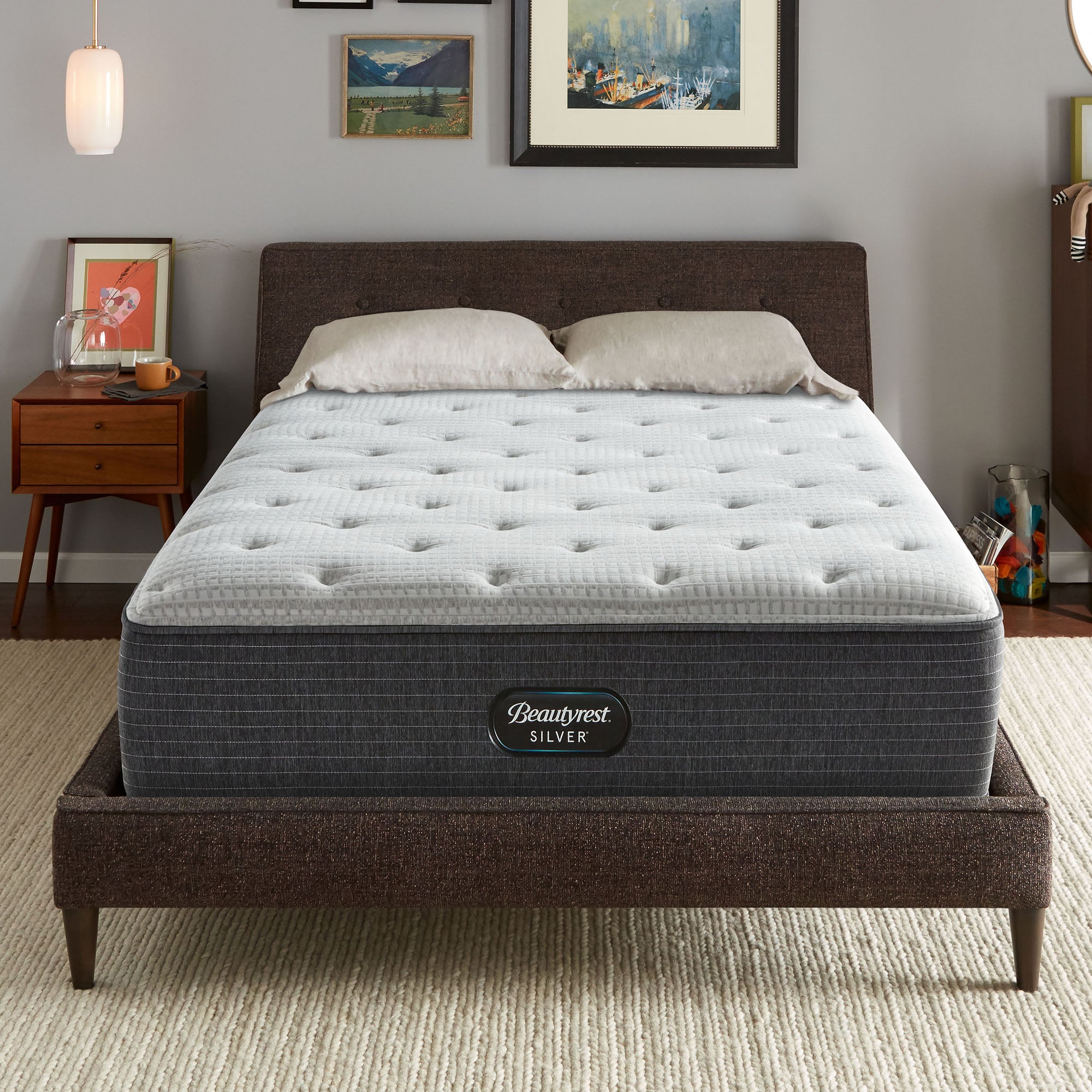 The Beautyrest Silver BRS900-C Medium mattress in a bedroom on a brown bed