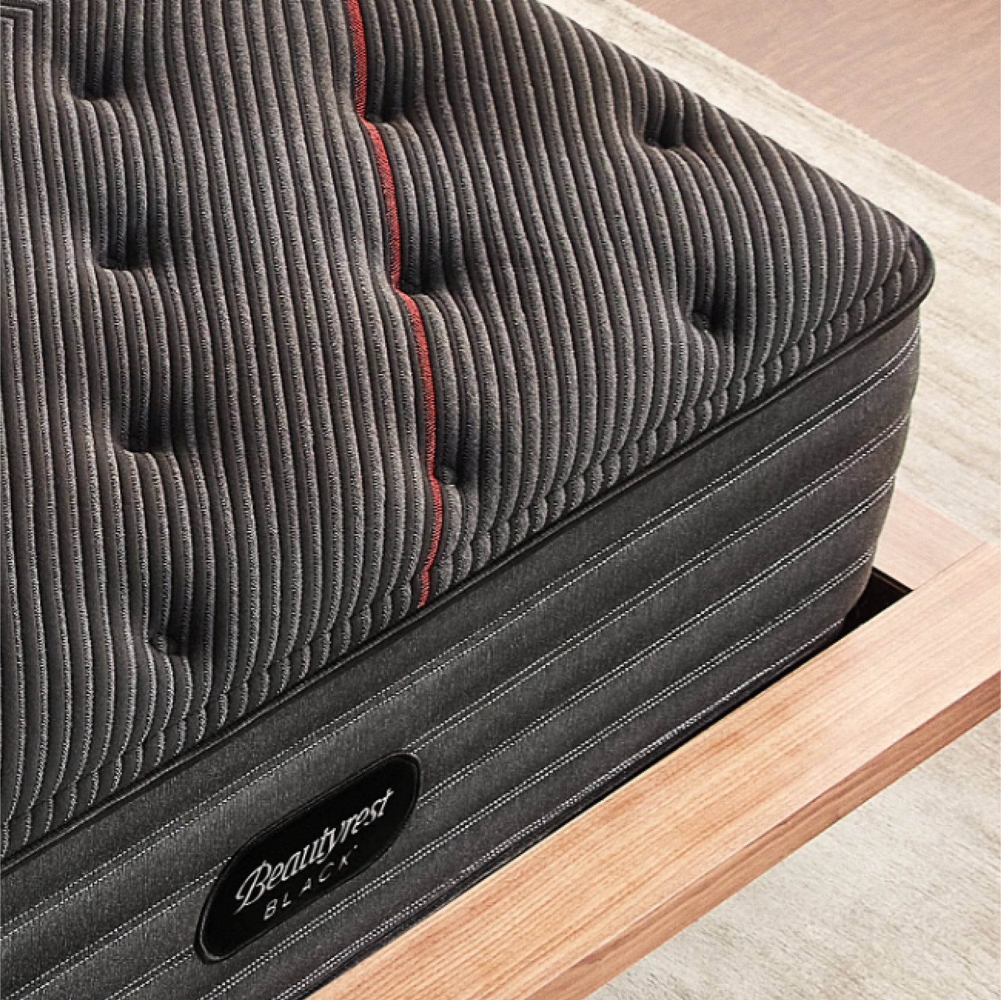 Corner view of the Beautyrest Black deluxe c-class mattress ||series: deluxe c-class|| feel: plush