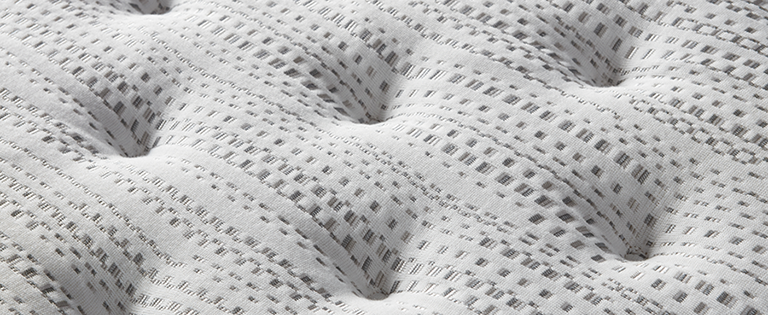 Close-up view of the fabric on a Beautyrest Silver BRS900 Extra Firm mattress