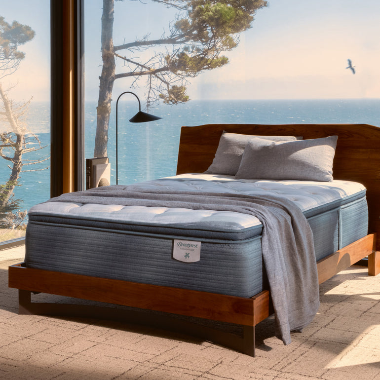 The Beautyrest Harmony Lux mattress in a bedroom by the ocean || series: Exceptional Coral Island || feel: firm pillow top