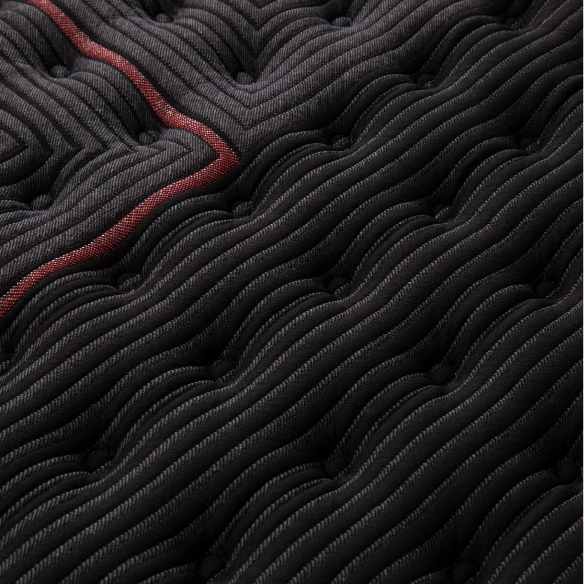 Close-up view of the fabric used on the Beautyrest Black mattress || series: deluxe c-class || feel: extra firm