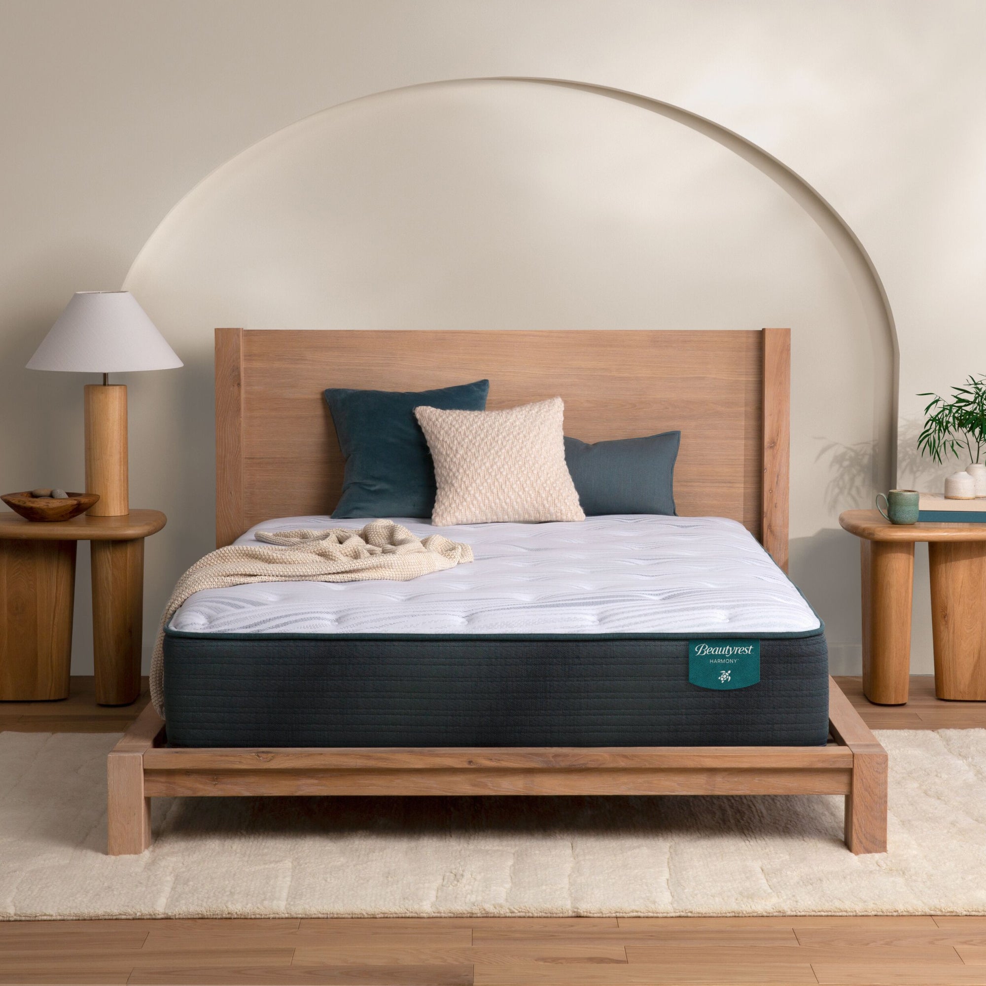 The Beautyrest Harmony medium mattress in a bedroom on a wooden bed|| series: Exceptional Cypress Bay || feel: medium
