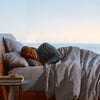 A man sleeping next to incense on a Beautyrest Harmony Lux mattress || series: Premier Anchor Island || feel: plush pillow top