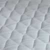 A hand pressing on the material of a Beautyrest Harmony mattress || series: Premier Beachfront Bay || feel: firm