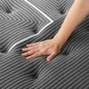 Hand pressing the fabric of the Beautyrest Black mattress || series: grand b-class || feel: plush pillow top