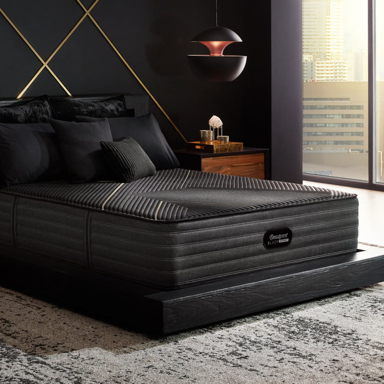 The Beautyrest Black hybrid mattress in a bedroom on a black bed||series: exceptional kx-class||feel: plush