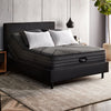 The Beautyrest Black hybrid mattress in a bedroom on a black bed||series: enhanced lx-class