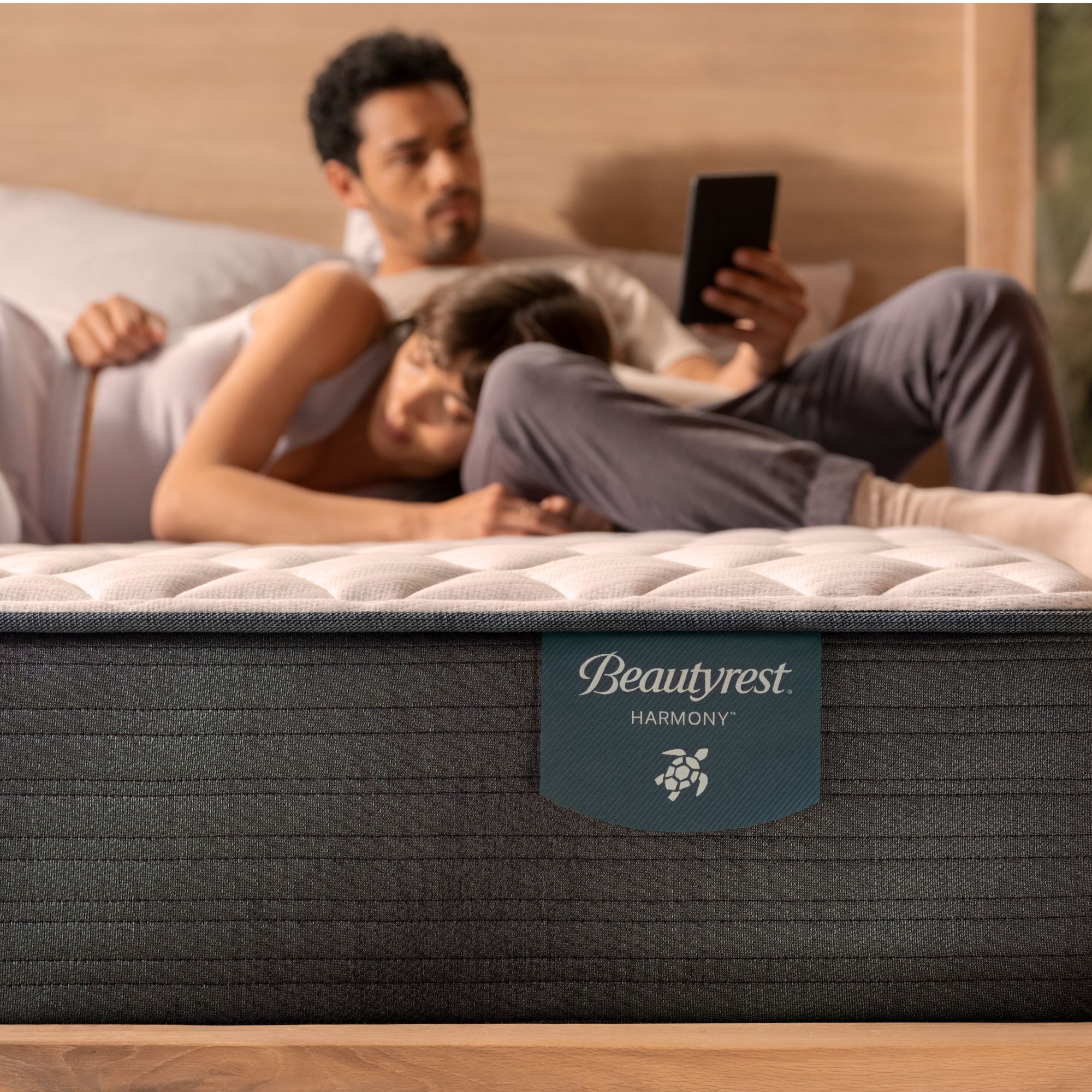 A couple lounging on the Beautyrest Harmony mattress || series: Premier Beachfront Bay || feel: firm