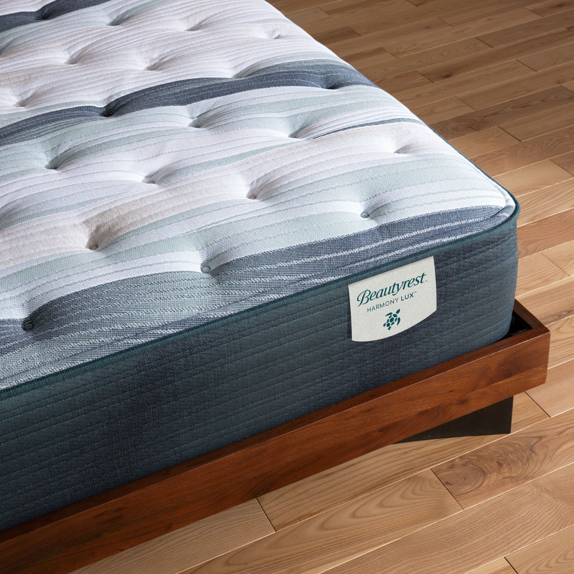 Corner view of the Beautyrest Harmony Lux mattress in a bedroom || series: Exceptional Coral Island || feel: medium