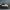 The Beautyrest Harmony Lux mattress in a bedroom on a blue carpet