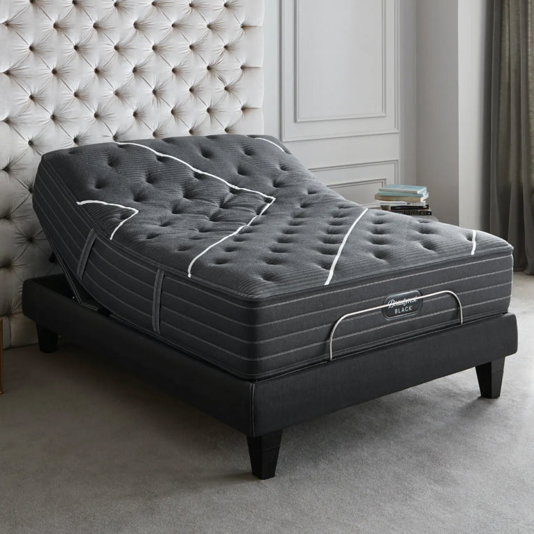 The Beautyrest Black Luxury Base with a mattress on top, in a bedroom