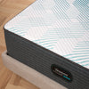 Corner view of the Beautyrest PressureSmart mattress in a bedroom||feel: firm||series: hybrid