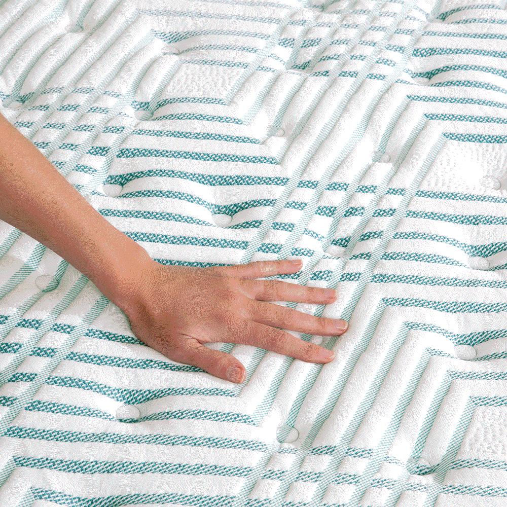 A hand pressing on the material, showing the firmness of the Beautyrest PressureSmart mattress || feel: firm || series: standard