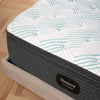 Corner view of the Beautyrest PressureSmart mattress in a bedroom||feel: plush pillow top||series: standard