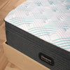 Corner view of the Beautyrest PressureSmart mattress in a bedroom||feel: firm pillow top||series: lux