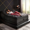 Woman lounging on the Beautyrest Black mattress in a bedroom||series: exceptional k-class